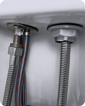 Close up of a dark wooden chair with black metal legs.